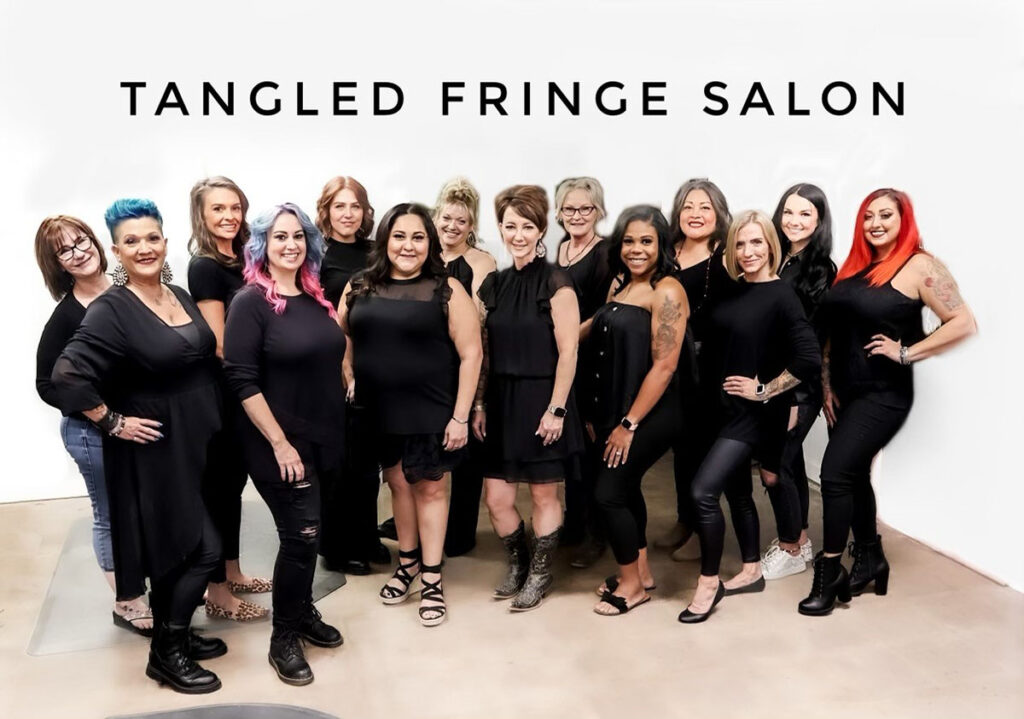 group photo of stylists at the hair salon - Tangled Fringe Salon