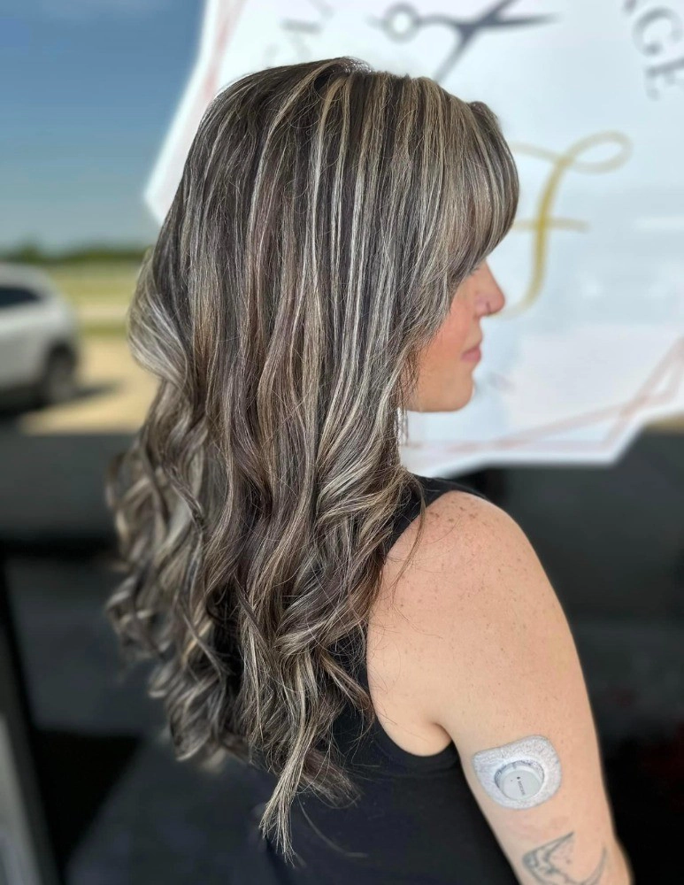 highlighted hair styled with loose beach curls